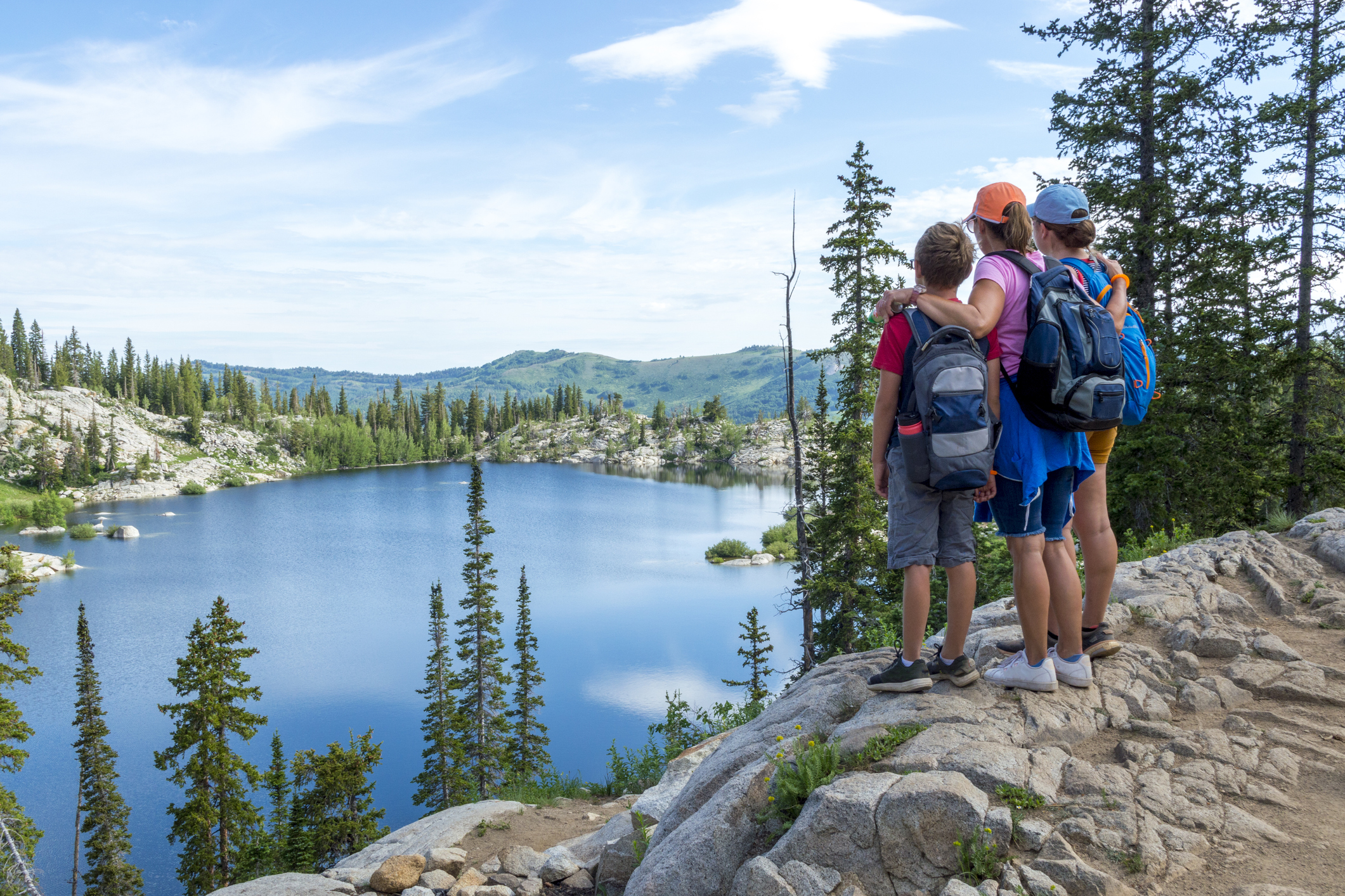 Family looking at a lake in the mountains